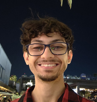 Vinícius smiling at night