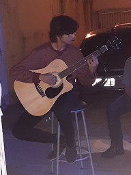 Vinícius playing guitar